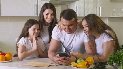 Happy Family Uses a Smartphone