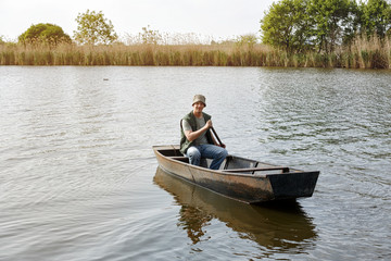 Fototapeta na wymiar Fisherman in fishing boat .