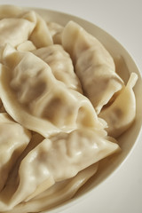 Fototapeta na wymiar A bowl of typical Chinese pork dumplings