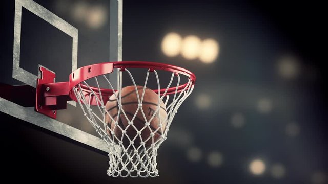 A Throw In A Basketball Ring On The Background Of Yellow Spotlights