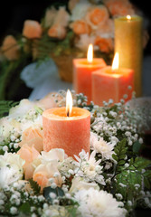 Fototapeta na wymiar Candle on floral background
