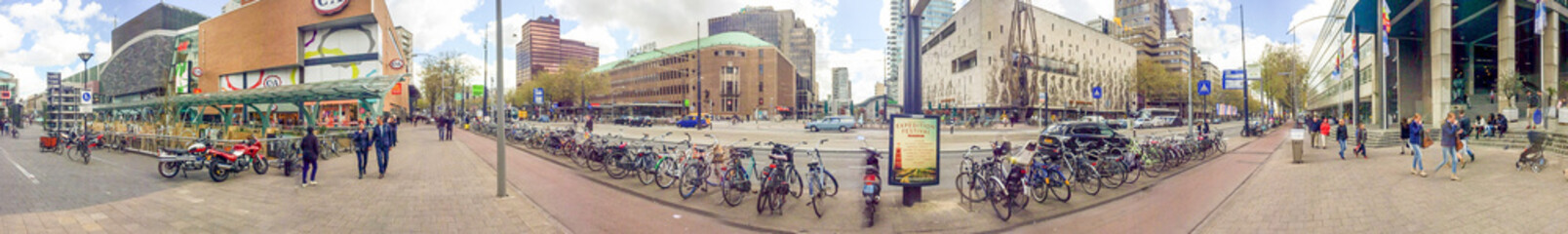 ROTTERDAM, THE NETHERLANDS - APRIL 2015: Tourists visit city streets. This is a major tourist...