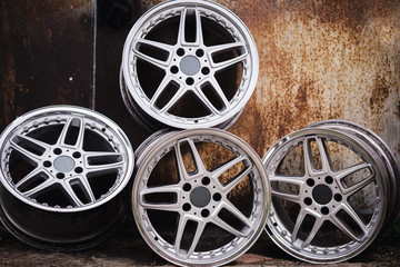 Sport wheels on the old metal background