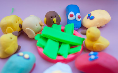 toys made of plasticine standing together