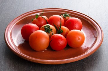 tomato on brown plate