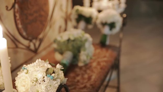 Bouquets on the bench. Switching focus. Wedding decorations