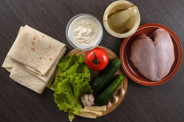 Shaurma ingredients composition on wooden background