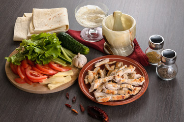 Shaurma ingredients composition on wooden background