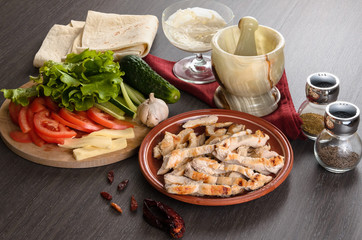 Shaurma ingredients composition on wooden background