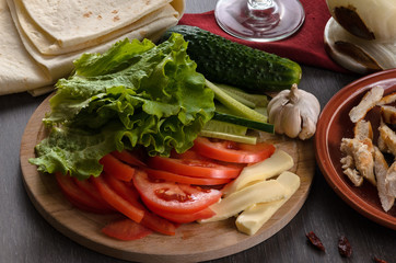 Shaurma ingredients composition on wooden background