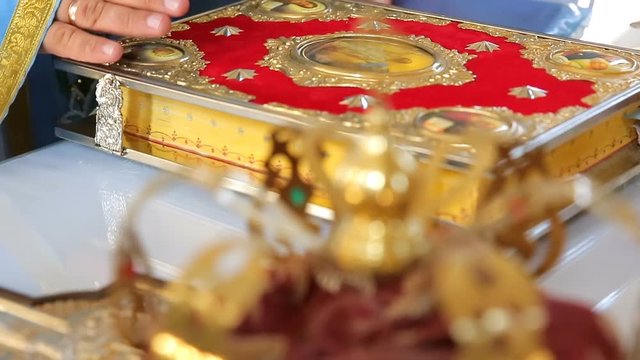 Priest closed the gospel. Holy Book. Various accessories for the wedding in the church in Ukraine