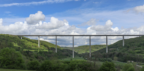 Fototapeta na wymiar Large Bridge Spanning over Valley