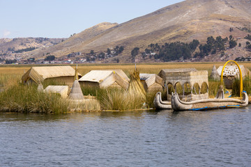 Los Uros artificial floating islands made of reeds on Lake Titicaca, Peru.