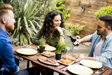 Young people have lunch in the backyard