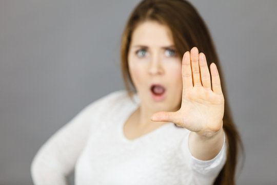 Angry apodicticity woman showing stop with hand
