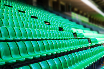 Obraz premium Green plastic seats at stadium