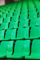 Green plastic seats at stadium