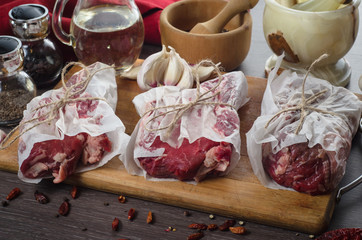 Raw fresh meat rib eye steak composition on wooden background
