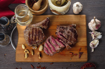 Grill meat rib eye steak composition on wooden background