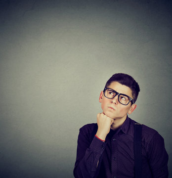 man thinking making up his mind looking up