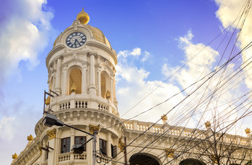 Clock tower of Metropolitan building colonial architecture at Kolkata India