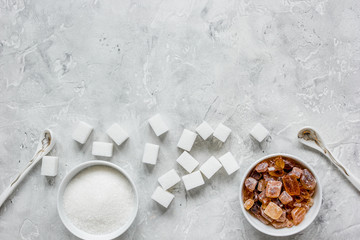 cooking sweets set with different sugar lumps on gray table background top view mockup
