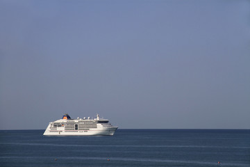 Fototapeta na wymiar Cruise ship at the sea, sky and horizon.