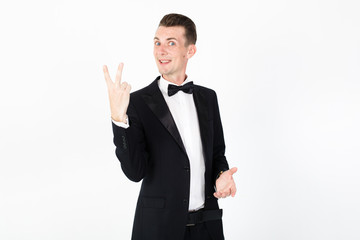 Young man master performing on the stage. Man in blue suit on white background with copy space