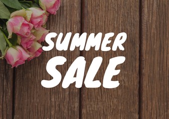 Overhead with roses on desk and white summer sale text