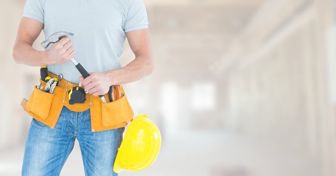 Carpenter  with tools on building site
