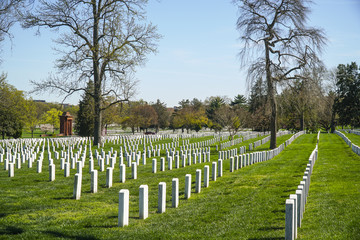 Fototapeta na wymiar The White tombstones at Arlington Cemetery in Washington - WASHINGTON, DISTRICT OF COLUMBIA - APRIL 8, 2017