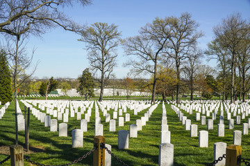 Fototapeta na wymiar The White tombstones at Arlington Cemetery in Washington - WASHINGTON, DISTRICT OF COLUMBIA - APRIL 8, 2017