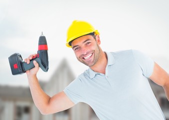 Carpenter  with drill on building site