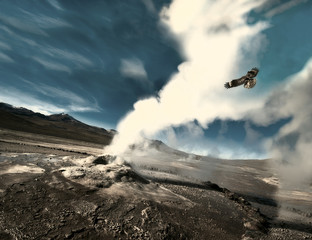 The eagle flies through the ejection of steam from the geyser. Valley of Geysers in the Atacama...