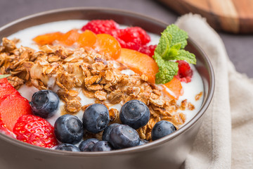 Yogurt with baked granola and berries