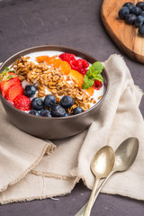 Yogurt with baked granola and berries