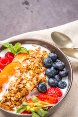 Yogurt with baked granola and berries