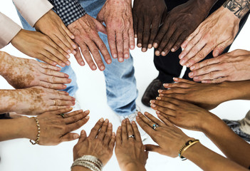 Group of hands assemble in aerial view