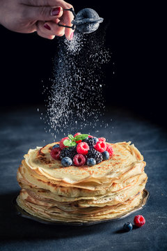 Sweet pancakes cake with blueberries and raspberries