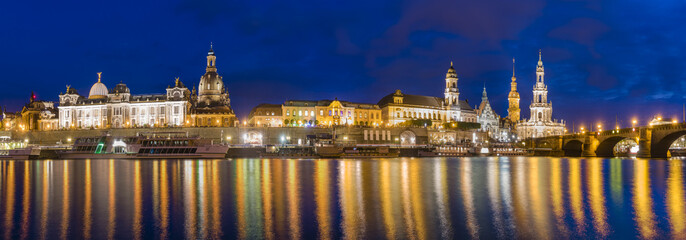 Fototapeta na wymiar Night view of the historic part of Dresden, city lights reflecting on the River Elbe