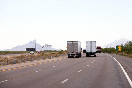 Arizona highway traffic with semi trucks trailers