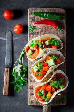Hot tacos with avocado, lime and tomato sauce