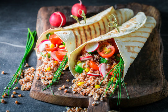 Enjoy your vegetarian tortilla with groats, chive and cherry tomatoes