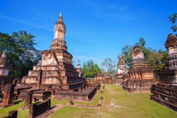 Fototapeta na wymiar Wat Chedi Jet Thaew at Si Satchanalai Historical Park, a UNESCO World Heritage Site in Thailand