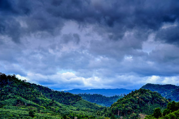 Rural view of mountain with rainy cloud