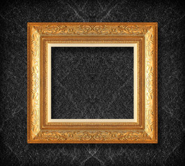 Fototapeta premium gold frame on black slate background