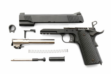 Disassembled handgun on white background. Seperate parts handgun. Pistol Part.