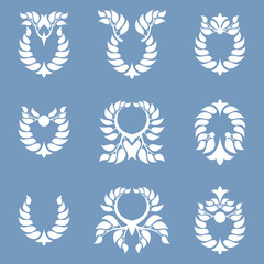 Set of abstract wreath on a blue background. Foliate element.
