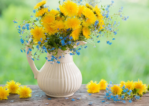 Fototapeta bouquet with forget-me-not and dandelions