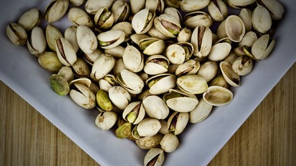 Pistachios on square plate